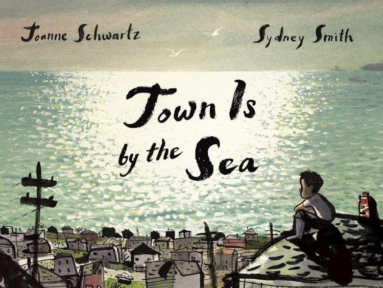 An image of the cover of Town Is by the Sea. There is an image of a small child looking out over a glittering sea with a town below.
